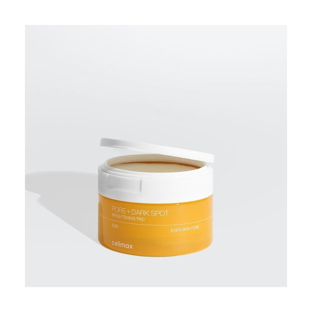 CELIMAX Pore + Dark Spot Brightening Pad - 40 discos / 100ml: envase o producto exacto sobre fondo blanco; cuidado cosmético y resultados visibles